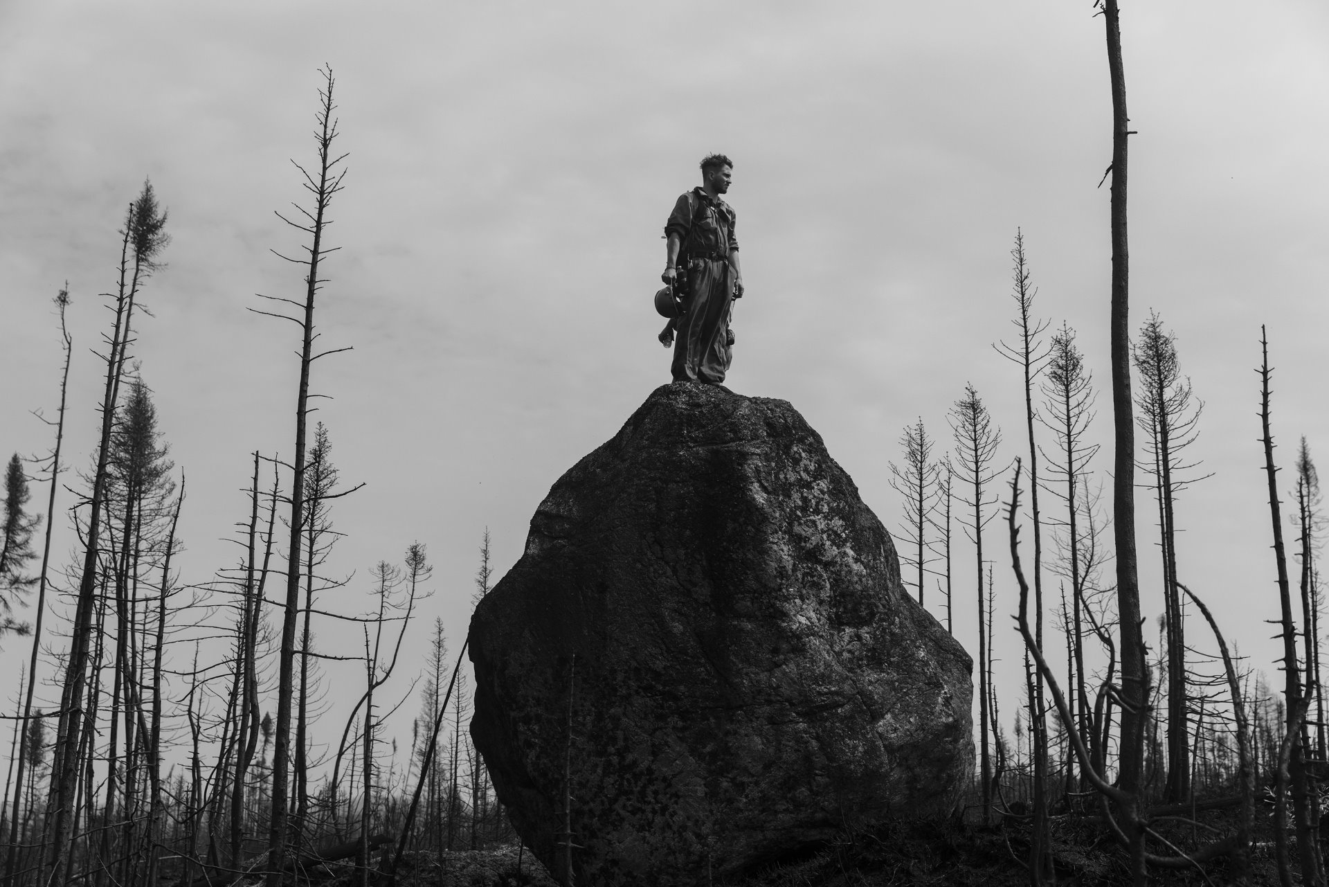 Theo Dagnaud scans the horizon to ensure that firefighter patrols have left, and he can mark the area as &ldquo;controlled&rdquo;. Quebec, Canada.
